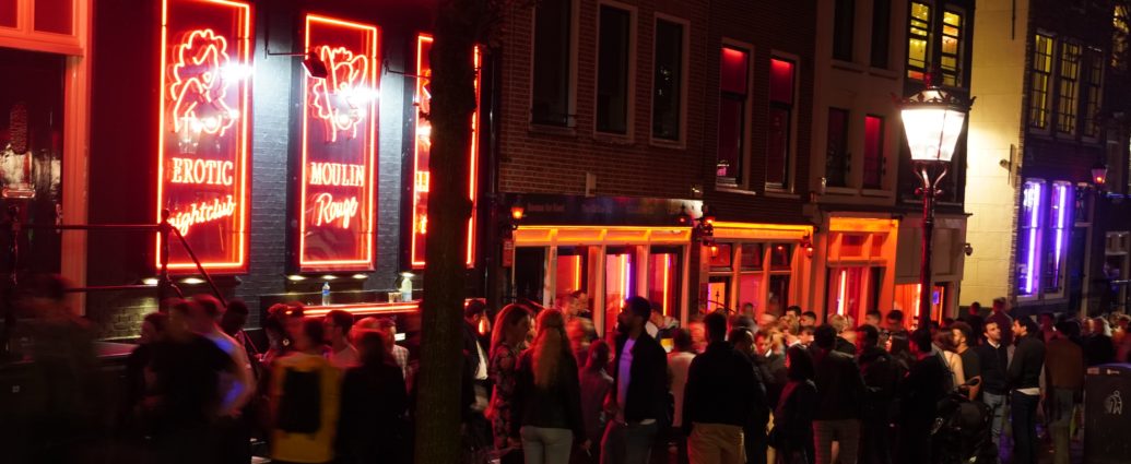 A picture of people outside Amsterdam's Moulin Rouge
