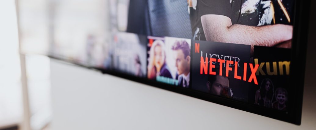 Netflix home screen on a television with the logo in the bottom right corner.