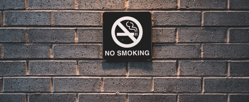 No smoking sign on brick wall