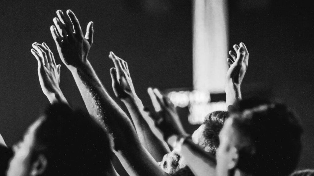 Black and White crowd cheering and clapping