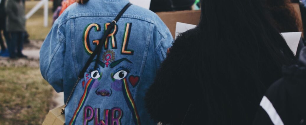 Girl wearing 'Girl Pwr' Jacket