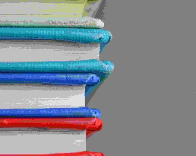 a stack of colourful books representing the studying students will do for their gcses