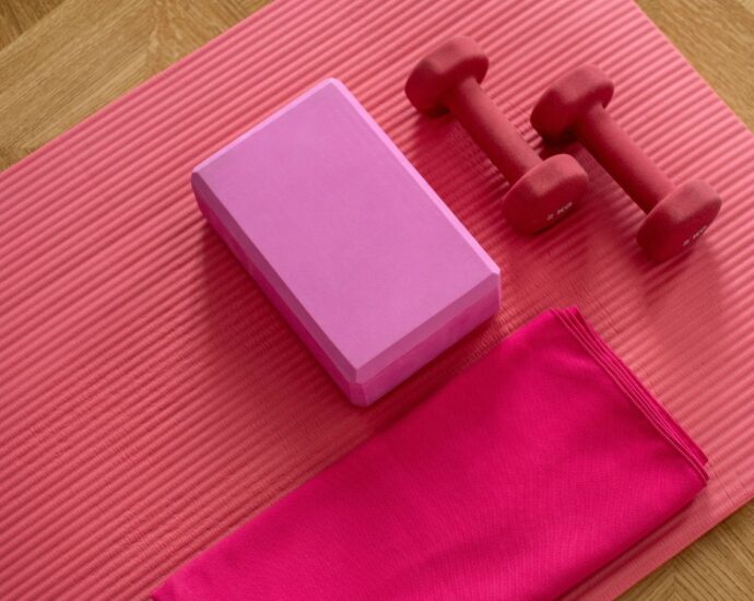 Pink exercise mat and weights.