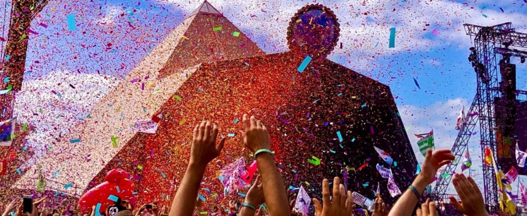 Confetti and crowds in front of Glastonbury's Pyramid Stage - the setting of this year's showdown between Rina Sawayama and Matty Healy