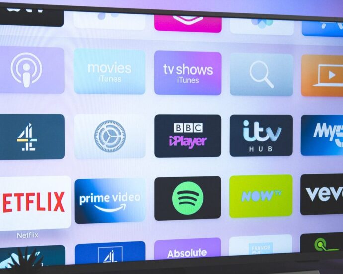 TV screen showing multiple app panels.