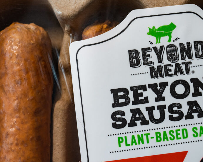 Image shows a packet of 'beyond meat' sausages: a meat industry sausage alternative.