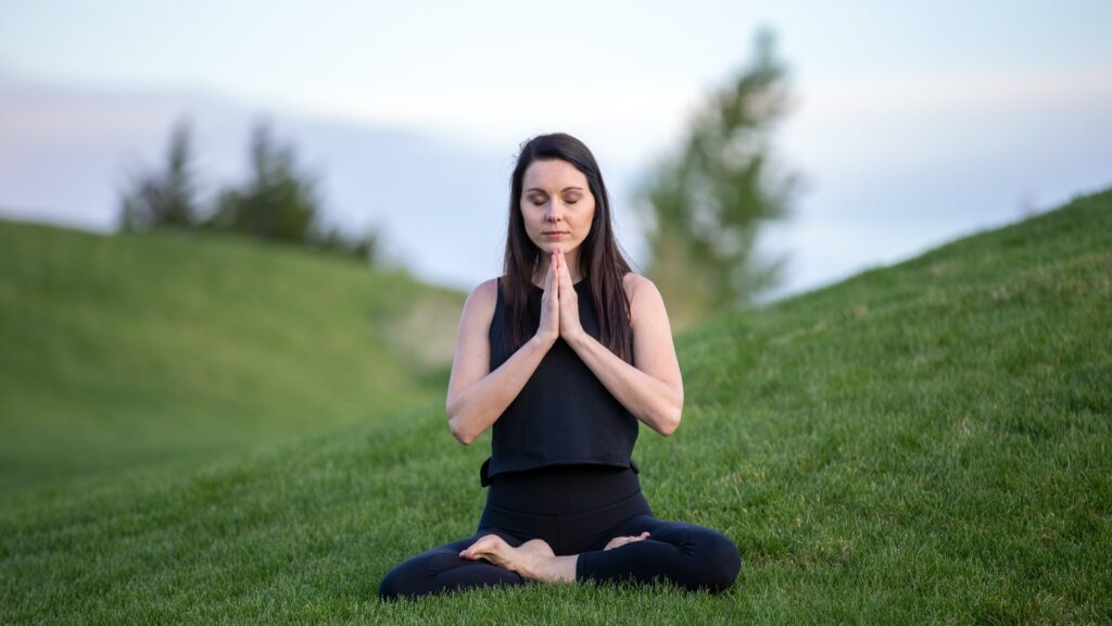 A woman practicing Vipassana meditation