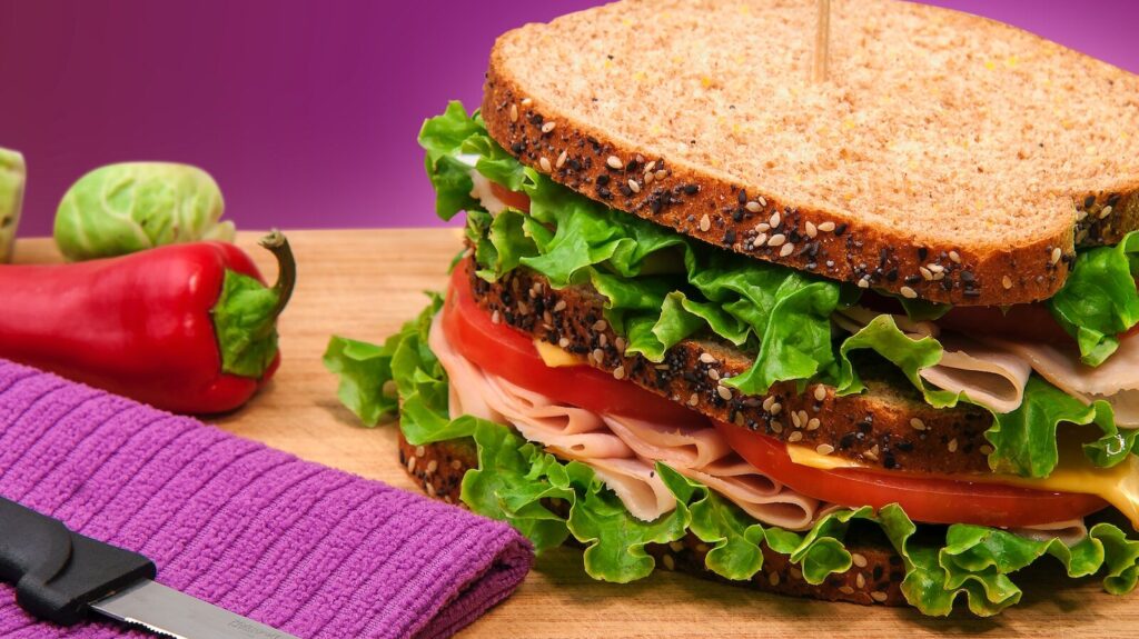 Image shows a sandwich on a table.