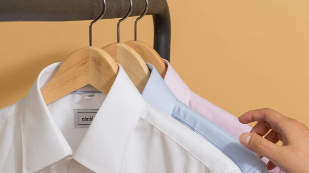 Image shows a railing with work clothes hanging on it