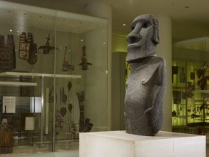 Image shows a stone moai statue from Easter Island, on display at the British Museum.