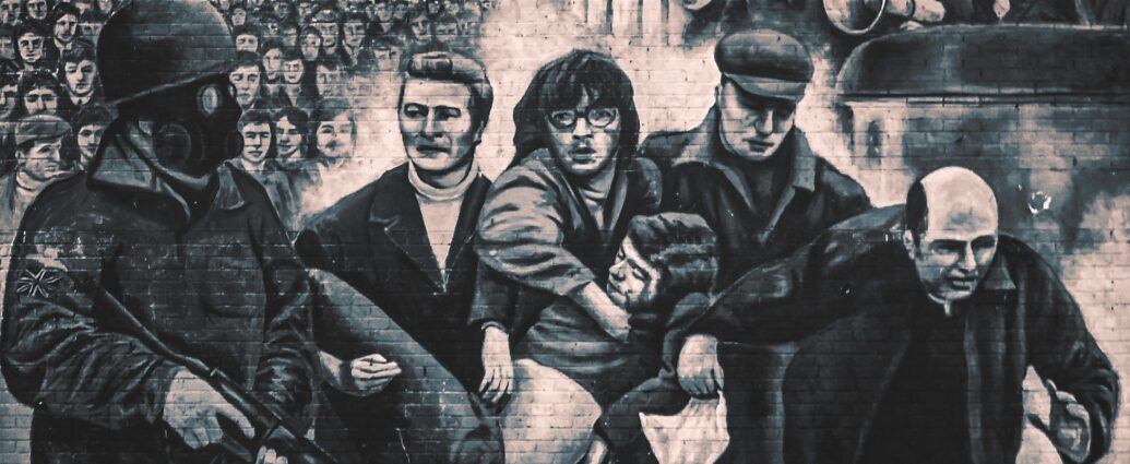 A mural at Free Derry Corner in Londonderry depicting Bloody Sunday, a significant historical event in Northern Ireland's Civil War.