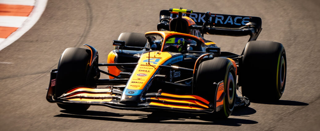 Image shows a Formula 1 car n race track.