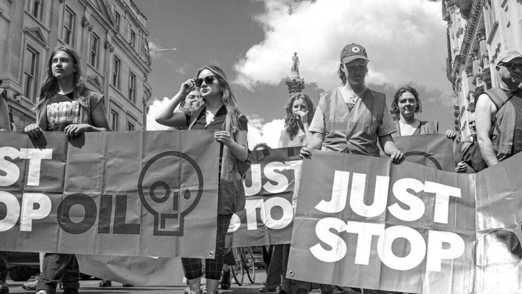 Black and white image of Just Stop Oil protestors.