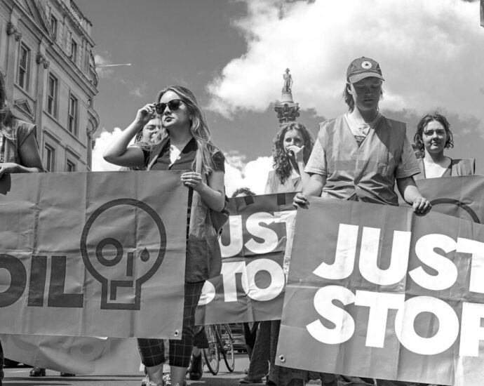 Black and white image of Just Stop Oil protestors.