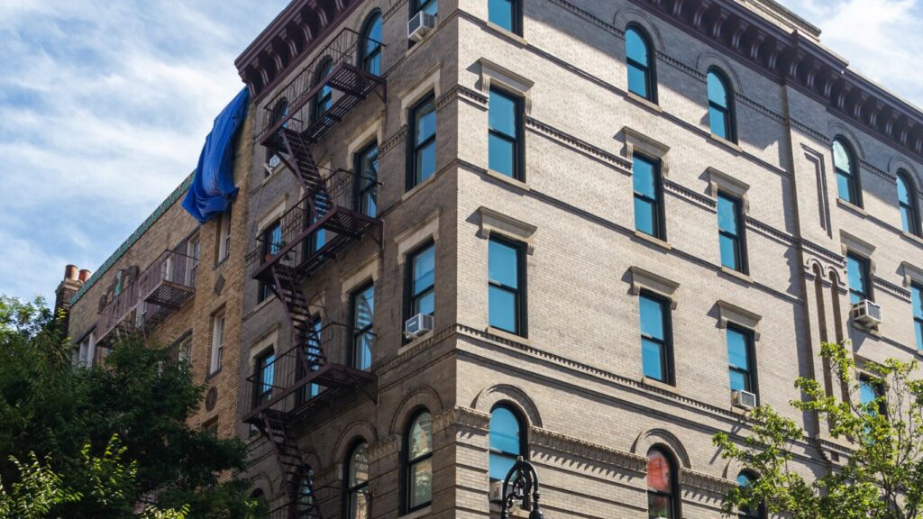 beige apartment block again blue sky. Known from TV show friends.