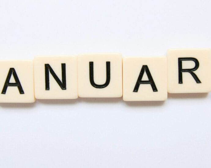 Image shows a calendar open on the month of January [January Blues]