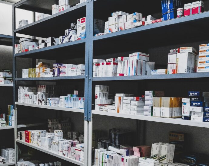 Image of medicines on shelves in a NHS pharmacy under new scheme.