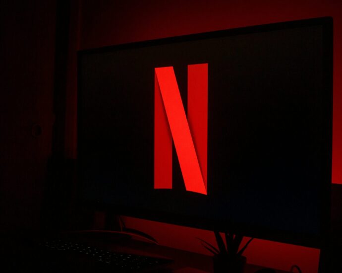 Black tv screen with red Netflix logo. Netflix's One Day
