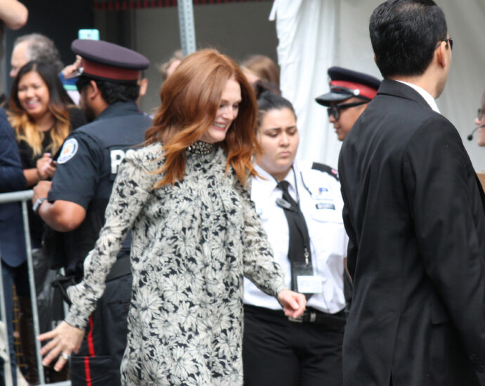 Actress Julianne Moore leaving a press conference at TIFF [May December]