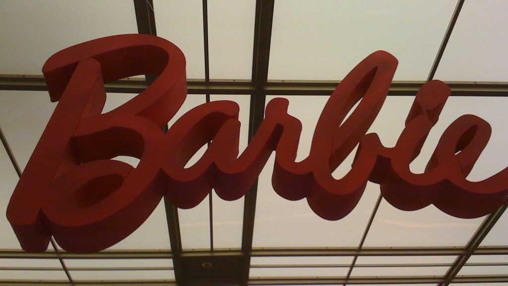 pink barbie logo against low light