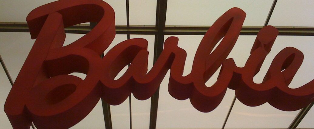 pink barbie logo against low light