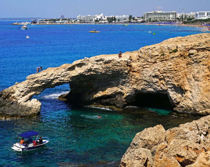 The Cypriot coastline with rocky shores and clear blue seas.
