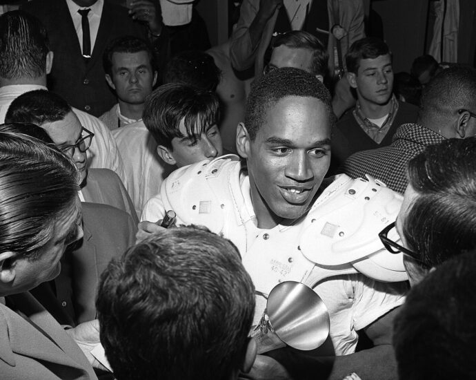 O.J. Simpson is interviewed by the press after leading Trojans to 14-3 Rose Bowl win. Simpson, who gained 128 yards in 25 carries, was named Player of the Game.