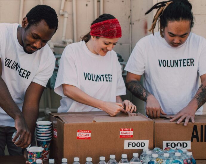Image shows a group of people volunteering