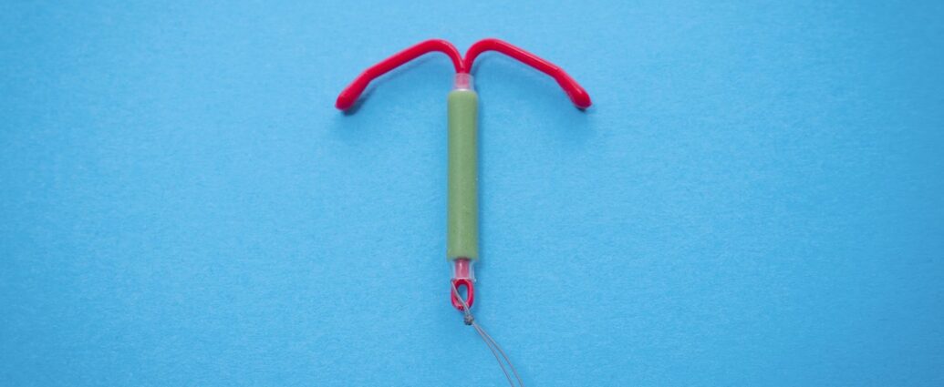 An IUD against a blue background