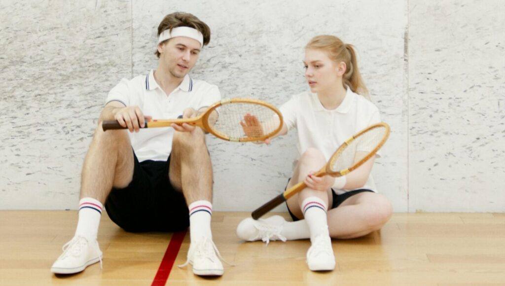 A couple exercising and playing tennis together