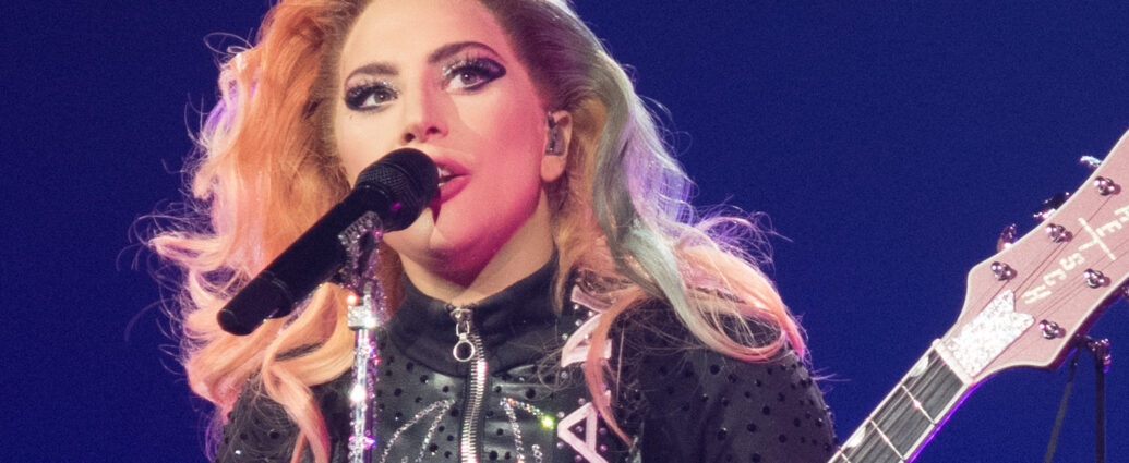 Lady Gaga singing with guitar