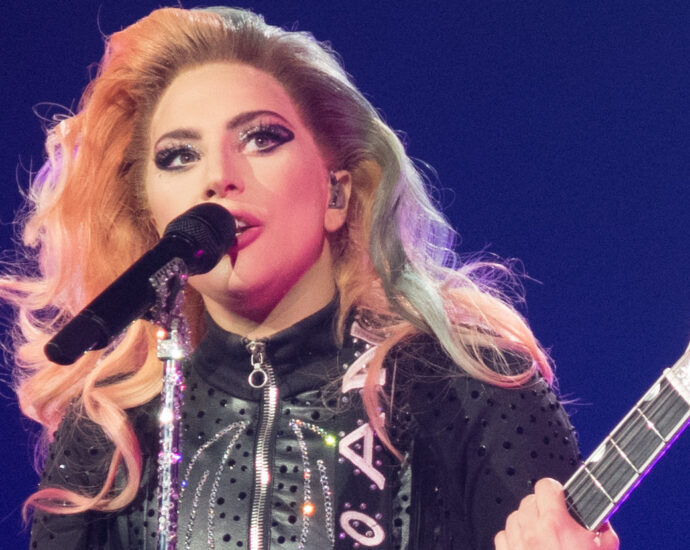 Lady Gaga singing with guitar