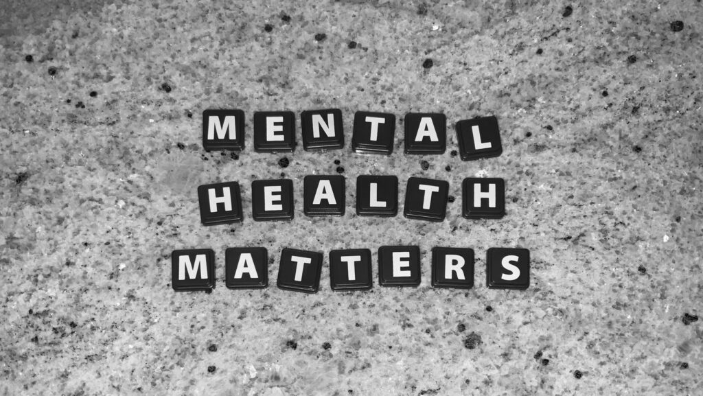Tiles with letters spelling out 'Mental health matters'.