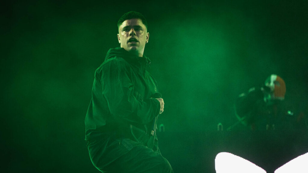 Kneecap performing on stage.