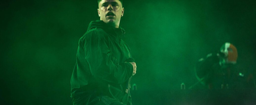 Kneecap performing on stage.