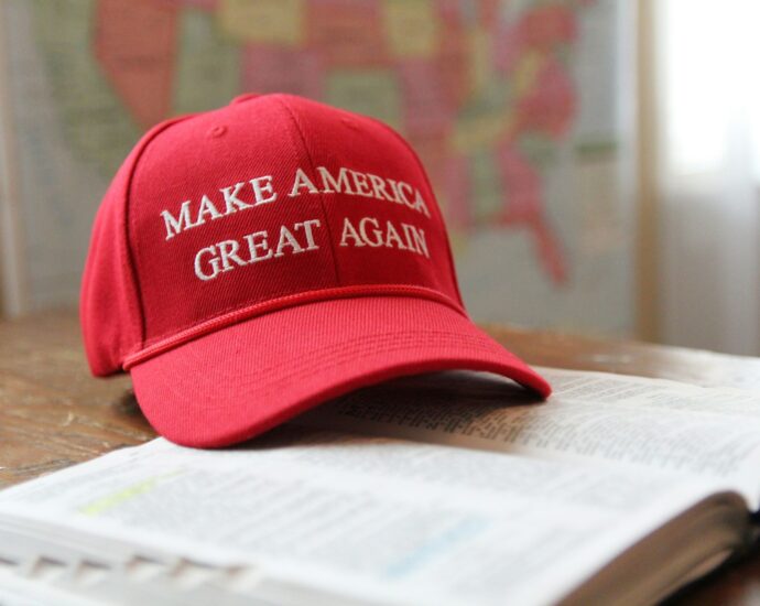 MAGA hat sitting on top of a bible.